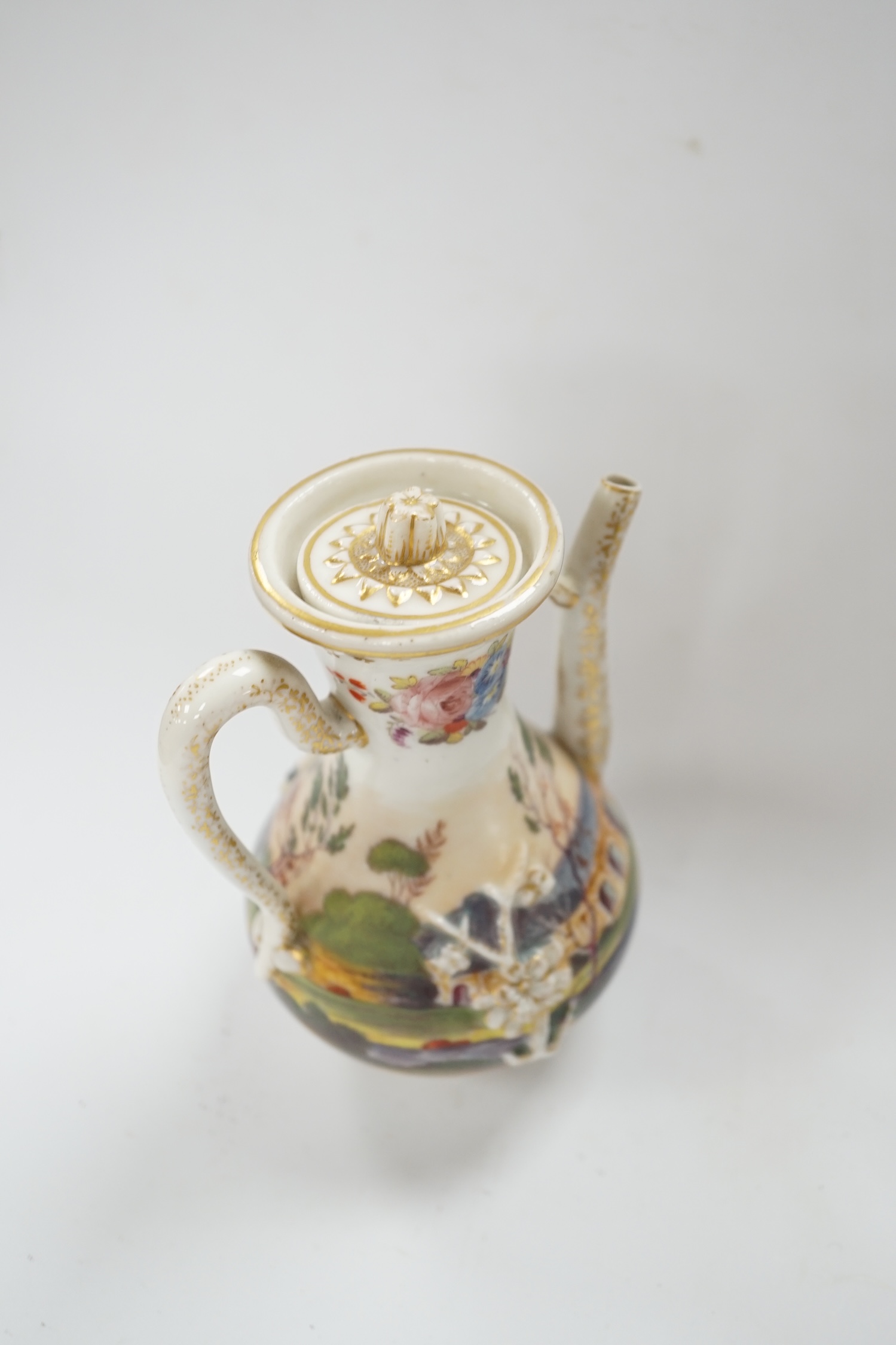 A 19th century Paris porcelain ewer and cover, hand painted with a riverscape and cattle, 13cm high. Condition - fair